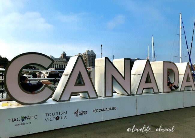 Discover the iconic "Canada" sign in Victoria, a must-visit spot for families. Capture the moment in front of this beloved landmark, showcasing your Canadian pride.