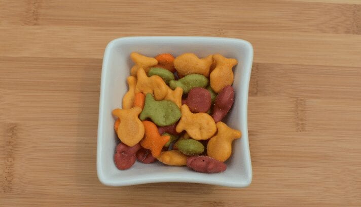Bowl of Goldfish crackers, small fish-shaped cheese crackers.