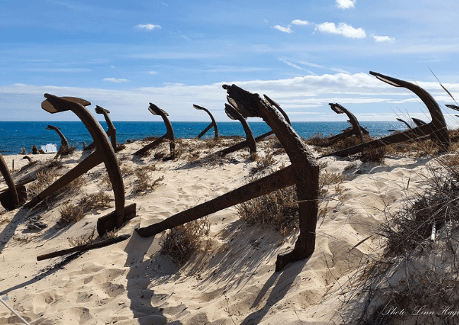 Old anchors beside the beach of the stunning southern region of Portugal, the Algarve.