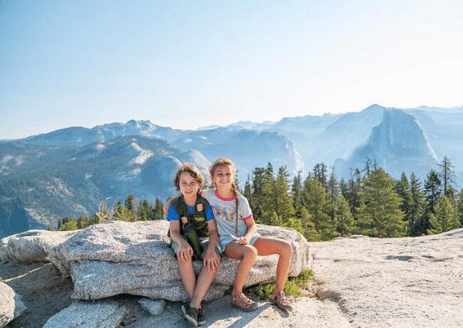 Two adventurous kids journey through the natural wonders of Yosemite National Park, where towering waterfalls, majestic cliffs, and lush forests become their playground. Yosemite's breathtaking beauty and endless opportunities for exploration make it a dream destination for families seeking outdoor adventure and inspiration.