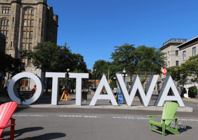 Capture the essence of Canada's capital city with the iconic Ottawa sign, standing tall and proud, symbolizing the vibrant energy, rich history, and diverse culture that await visitors in this captivating place.