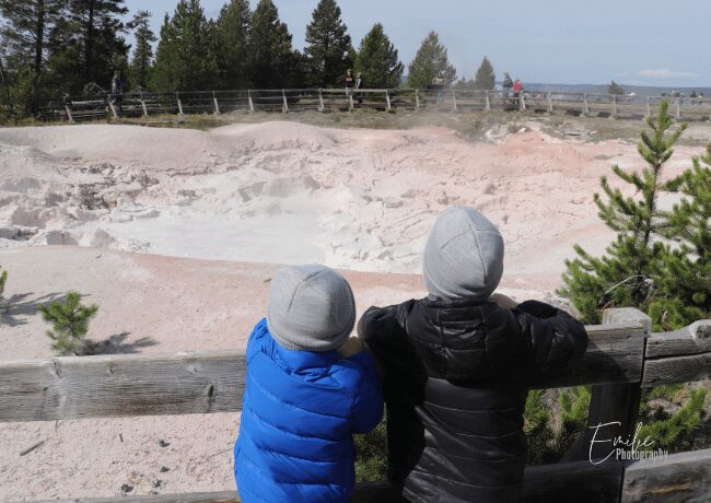 We were looking at the fantastic landscape of colorful volcanic mudstones—one of the unforgettable experiences we had during our trip to Yellowstone with the kids.