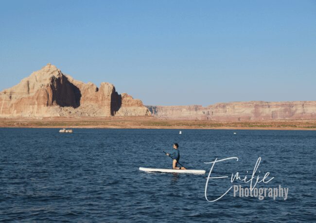 Embark on an aquatic adventure like no other as you paddleboard on the serene waters of Lake Powell. 