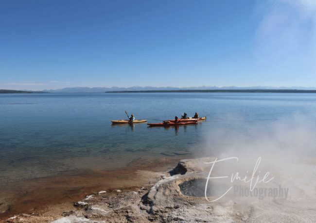 Immerse yourself in the serene grandeur of Yellowstone Lake, a tranquil oasis nestled within the park's majestic landscapes.