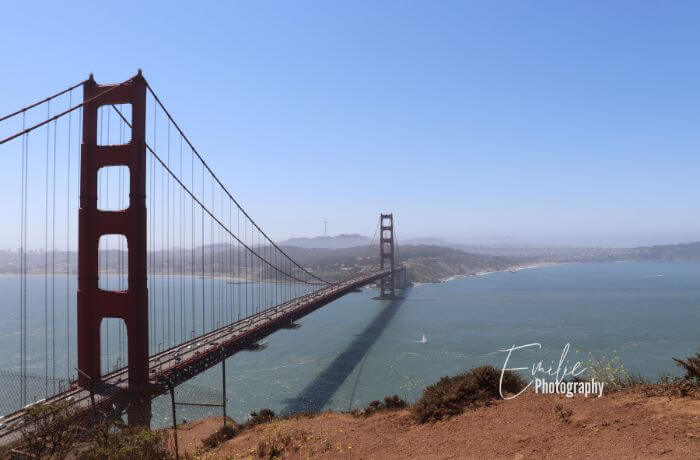 Behold the iconic beauty of the Golden Gate Bridge, one of the best things to do with kids, standing proudly against the backdrop of the San Francisco skyline, symbolizing both the engineering marvel and the charm of the City by the Bay.