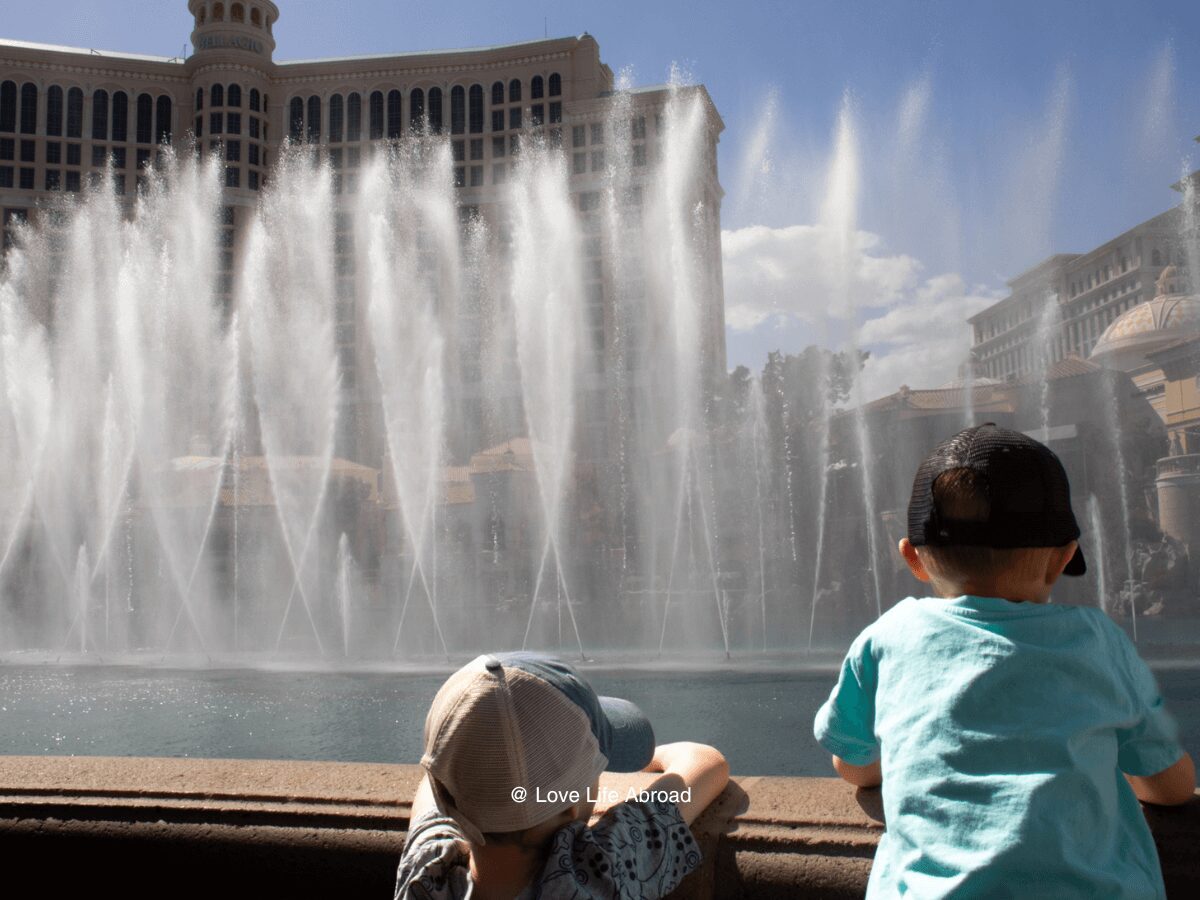 Fun things to do in Las Vegas with kids. My sons watching the Bellagio fountain show