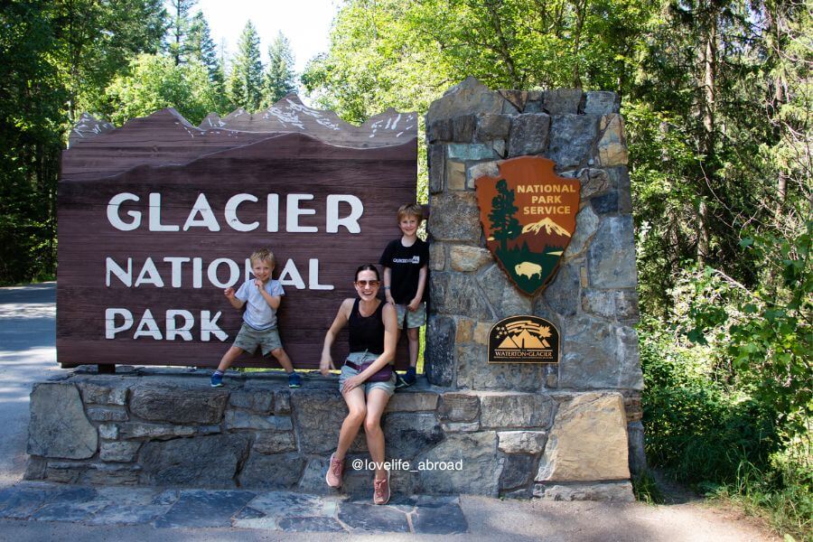 Glacier National Parks sign at the West Entrance, one of the best things to do in glacier national park with kids.