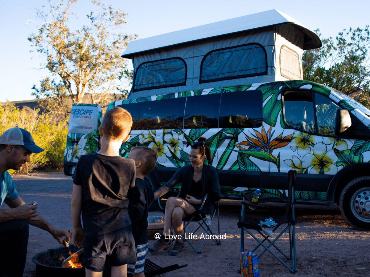 Family enjoying smores with Escape Campervans