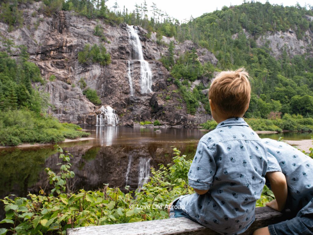 my sons enjoying the view of the Bridal Falls a short walk from the train station
