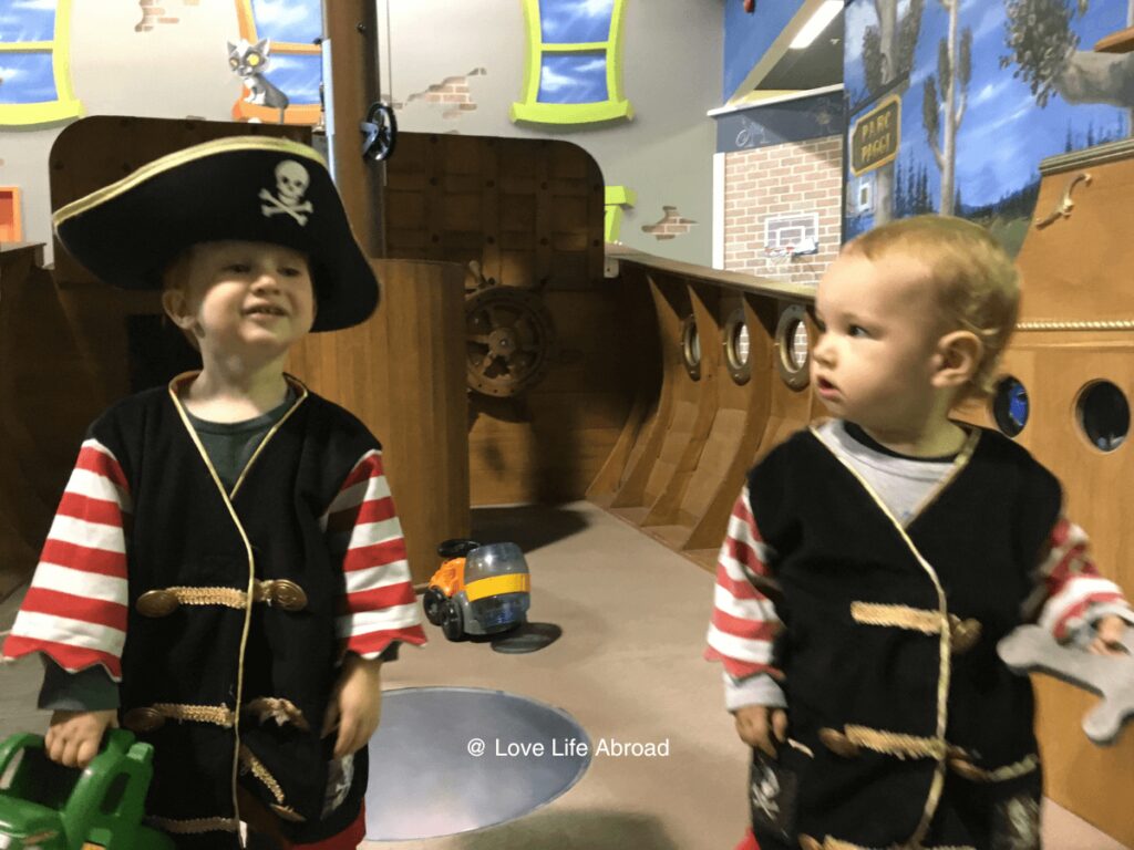 the boys customed in pirates at Imaginarius Fun Center an indoor playground in Quebec City