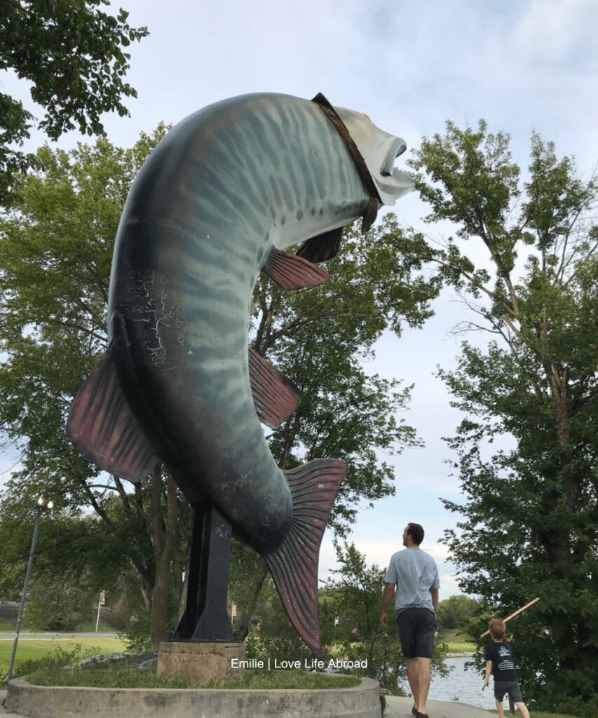 My husband and my son are looking at the Husky to Muskie statue in Kenora. It feels so big