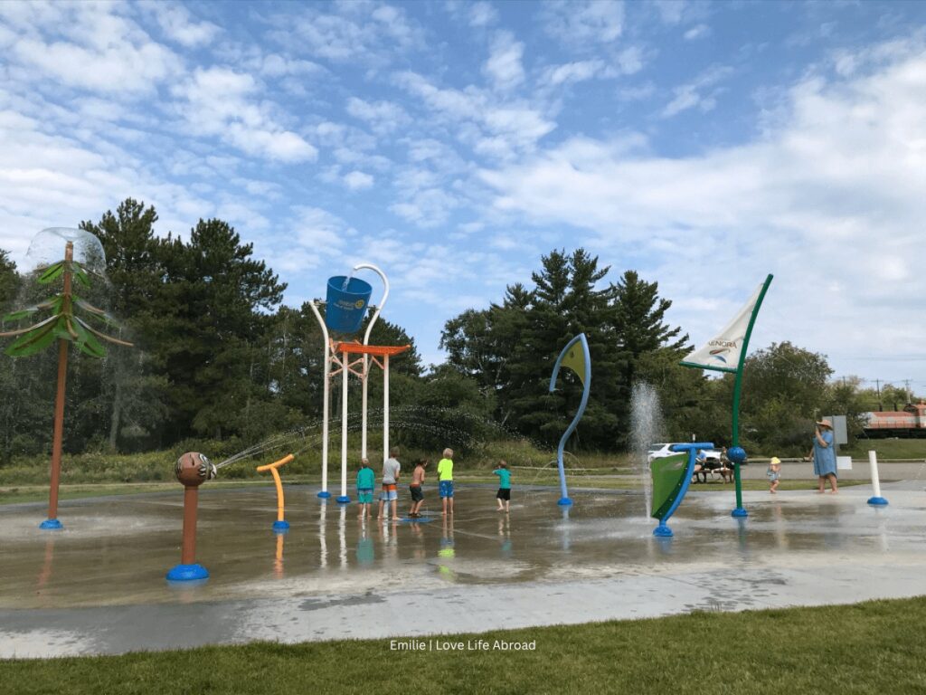 The kids are playing in the spray park in Norman Park in Kenora